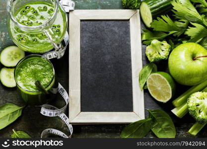 Fresh green vegetables and smoothie on vintage background - detox, diet or healthy food concept