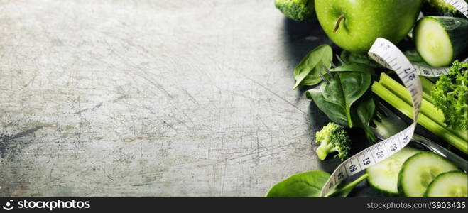 Fresh green vegetables on vintage background - detox, diet or healthy food concept