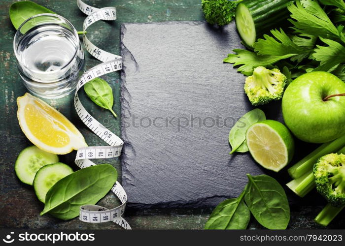 Fresh green vegetables on vintage background - detox, diet or healthy food concept