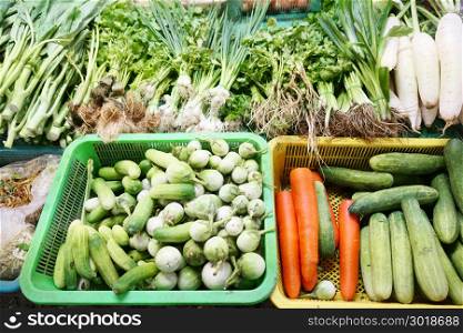 Fresh greens, cucumbers, green tomato, carrots in the market