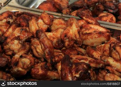 Fresh grilled poultry products on display at a poulterer store
