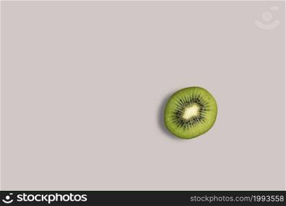 Fresh half kiwi fruits on a white background for the menu. Geometric background. Flat lay, copy space, top view.
