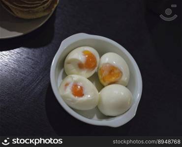 Fresh hard boiled chicken eggs on bowl