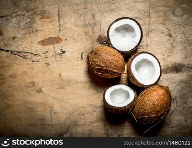 Fresh hard coconuts. On a wooden background .. Fresh hard coconuts.