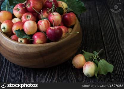Fresh harvest of apples an a wooden background, nature fruit concept