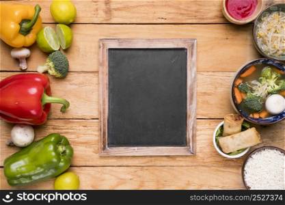 fresh harvested vegetables thai traditional food with blank slate wooden table