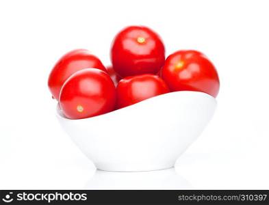Fresh healthy cherry tomatoes in white bowl on white background