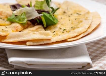 fresh healthy garlic pita bread pizza with salad on top
