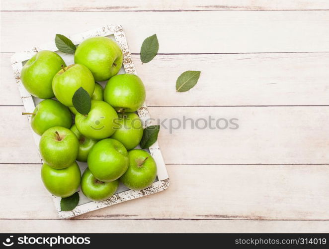 Fresh healthy organic apples in vintage box on wood background