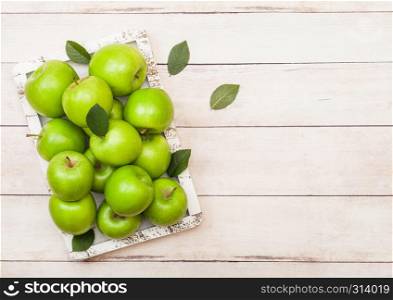 Fresh healthy organic apples in vintage box on wood background