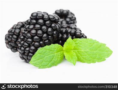 Fresh healthy summer blackberries with mint leaf on white background