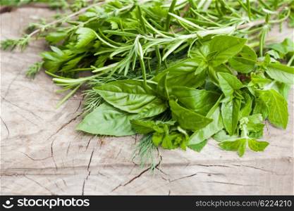 Fresh herbs outdoor on the wooden background. The Fresh herbs