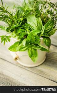 Fresh herbs outdoor on the wooden table