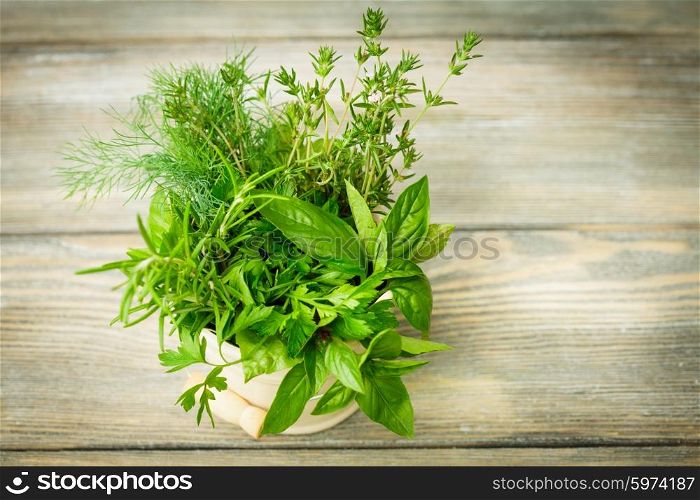 Fresh herbs outdoor on the wooden table. Fresh herbs