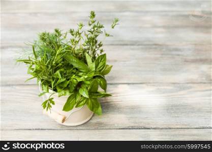 Fresh herbs outdoor on the wooden table. The Fresh herbs