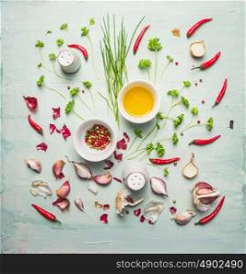 fresh herbs ,spices and cooking oil composing on rustic background, top view