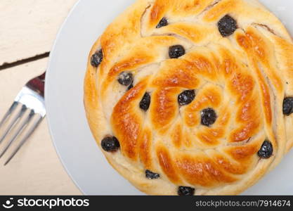 fresh home baked blueberry bread cake dessert over white wood table