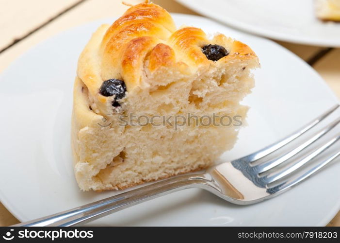 fresh home baked blueberry bread cake dessert over white wood table