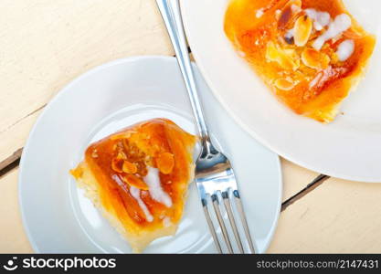 fresh home baked sweet bread donut cake with almonds and icing sugar on top