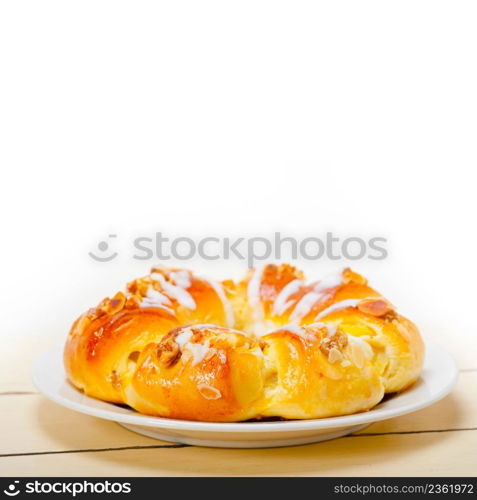 fresh home baked sweet bread donut cake with almonds and icing sugar on top