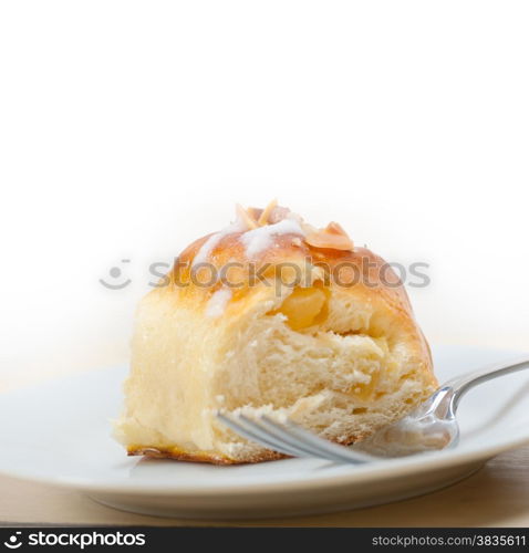 fresh home baked sweet bread donut cake with almonds and icing sugar on top