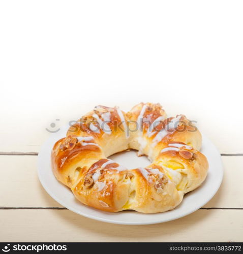 fresh home baked sweet bread donut cake with almonds and icing sugar on top