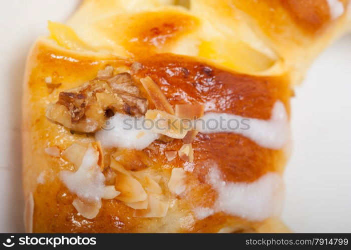 fresh home baked sweet bread donut cake with almonds and icing sugar on top