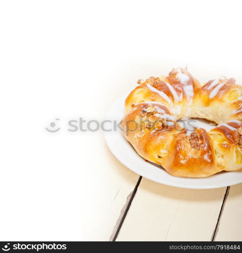 fresh home baked sweet bread donut cake with almonds and icing sugar on top