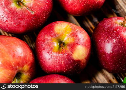 Fresh homemade apples on a wooden background. High quality photo. Fresh homemade apples on a wooden background.