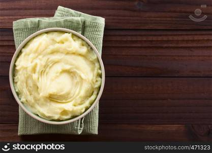Fresh homemade creamy mashed potato in bowl, photographed overhead with copy space on the right side (Selective Focus, Focus on the potato puree). Fresh Creamy Mashed Potato