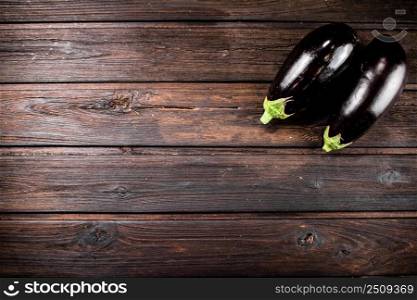 Fresh homemade eggplant on the table. On a wooden background. High quality photo. Fresh homemade eggplant on the table. 