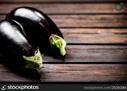 Fresh homemade eggplant on the table. On a wooden background. High quality photo. Fresh homemade eggplant on the table. 