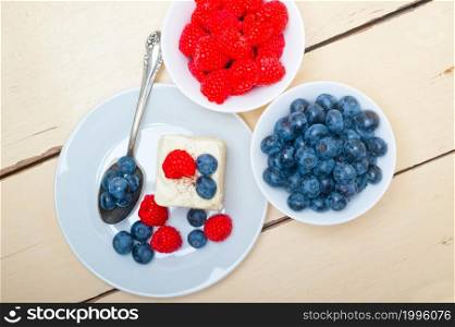 fresh homemade raspberry and blueberry cream cake