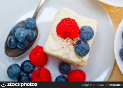 fresh homemade raspberry and blueberry cream cake