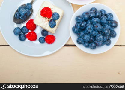 fresh homemade raspberry and blueberry cream cake