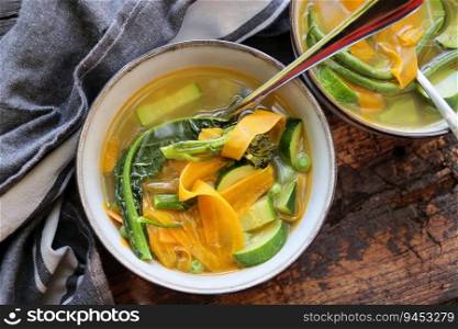 Fresh homemade vegetable soup on wooden table