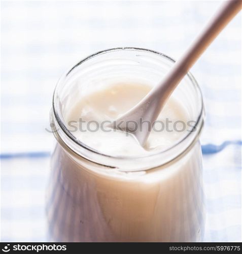 Fresh homemade yoghurt in a glass jar. Fresh yoghurt