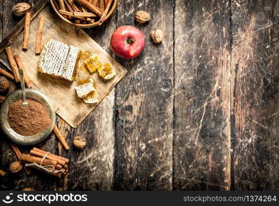 Fresh honey with Apple and cinnamon. On wooden background.. Fresh honey with Apple and cinnamon.
