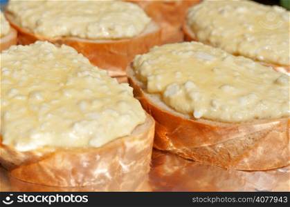 Fresh hot sandwiches with melted cheese and eggs. Closeup.
