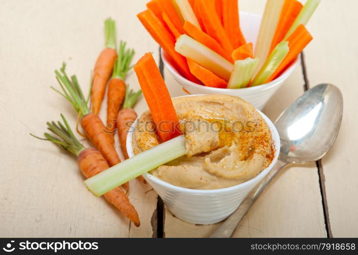 fresh hummus dip with raw carrot and celery arab middle eastent healthy food