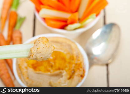 fresh hummus dip with raw carrot and celery arab middle eastent healthy food