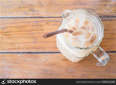 Fresh iced milk coffee in glass pitcher, stock photo