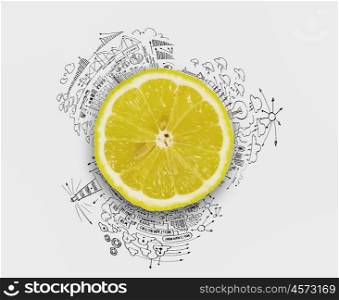 Fresh idea. Lemon half against background with business sketches