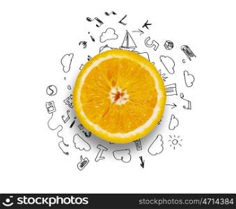 Fresh idea. Orange half against background with business sketches