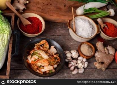 Fresh ingredients and vegetables Placed in the table For making Kimchi Which contains ingredients such as ginger, garlic, salt, onion, sugar, gochugaru  Korean chili . Kimchi is a healthy food.