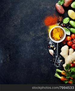 Fresh ingredients on dark background. Vegetarian food, health or cooking concept. Background layout with free text space.