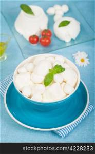 Fresh italian dairy products as mozzarella, ricotta and cherry tomatoes