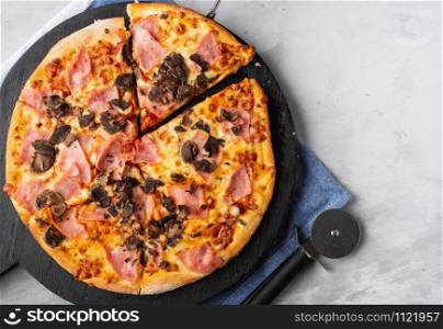 Fresh Italian pizza with bacon and mushrooms
