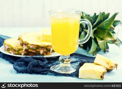fresh juice and pineapple on a table