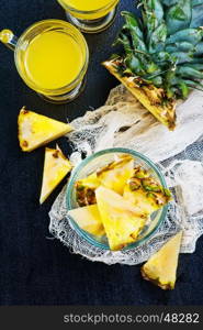 fresh juice and pineapple on a table